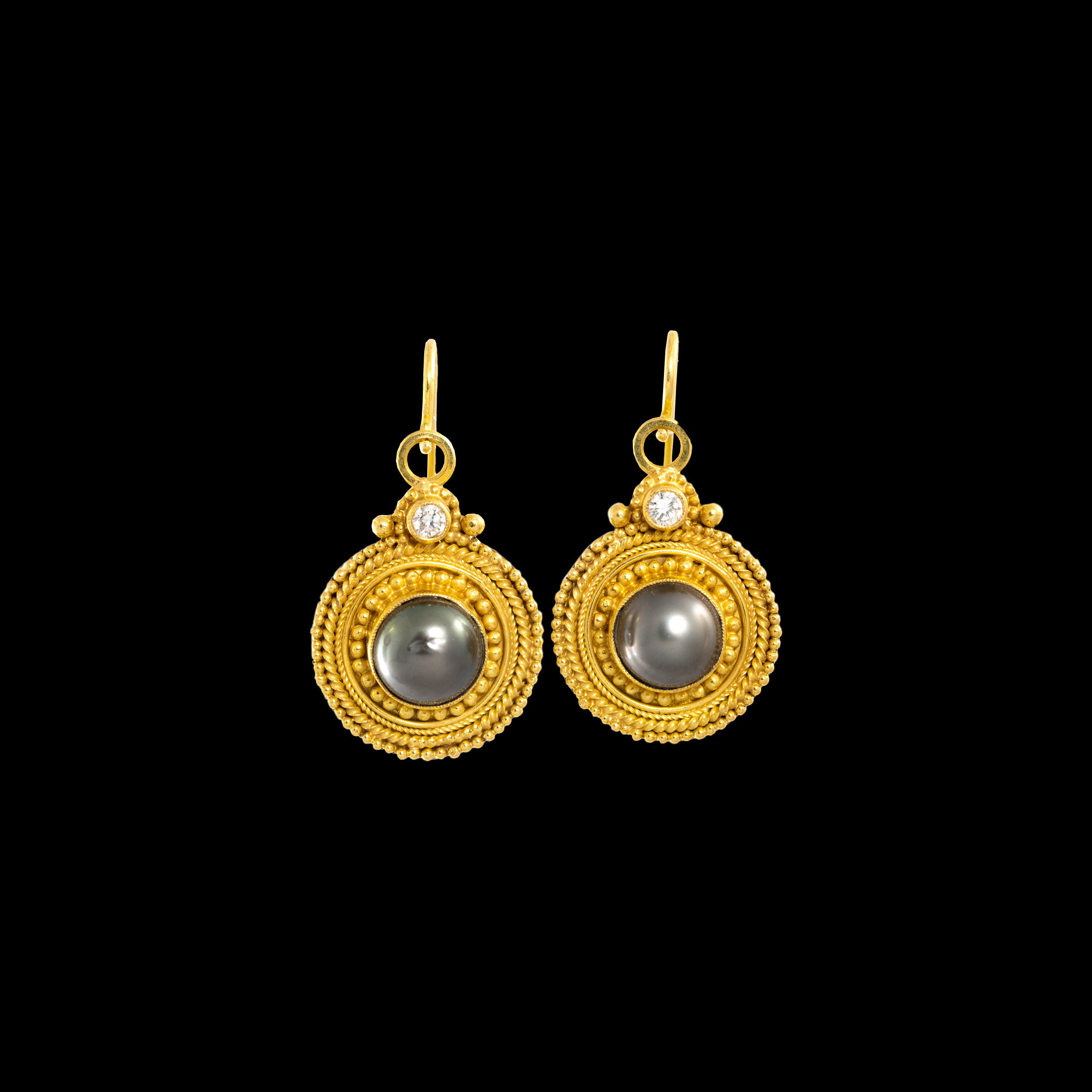 A pair of Etruscomania gold earrings. 
